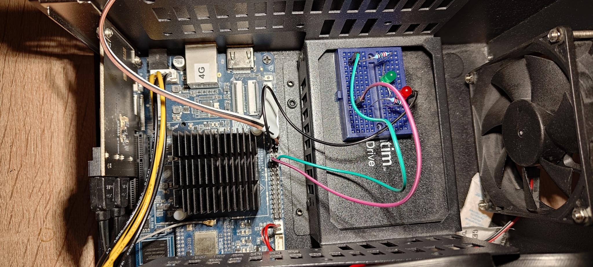 Picture of the RockPro64 wiring the pins 15 and 16 to LEDs (with resistors and ground)